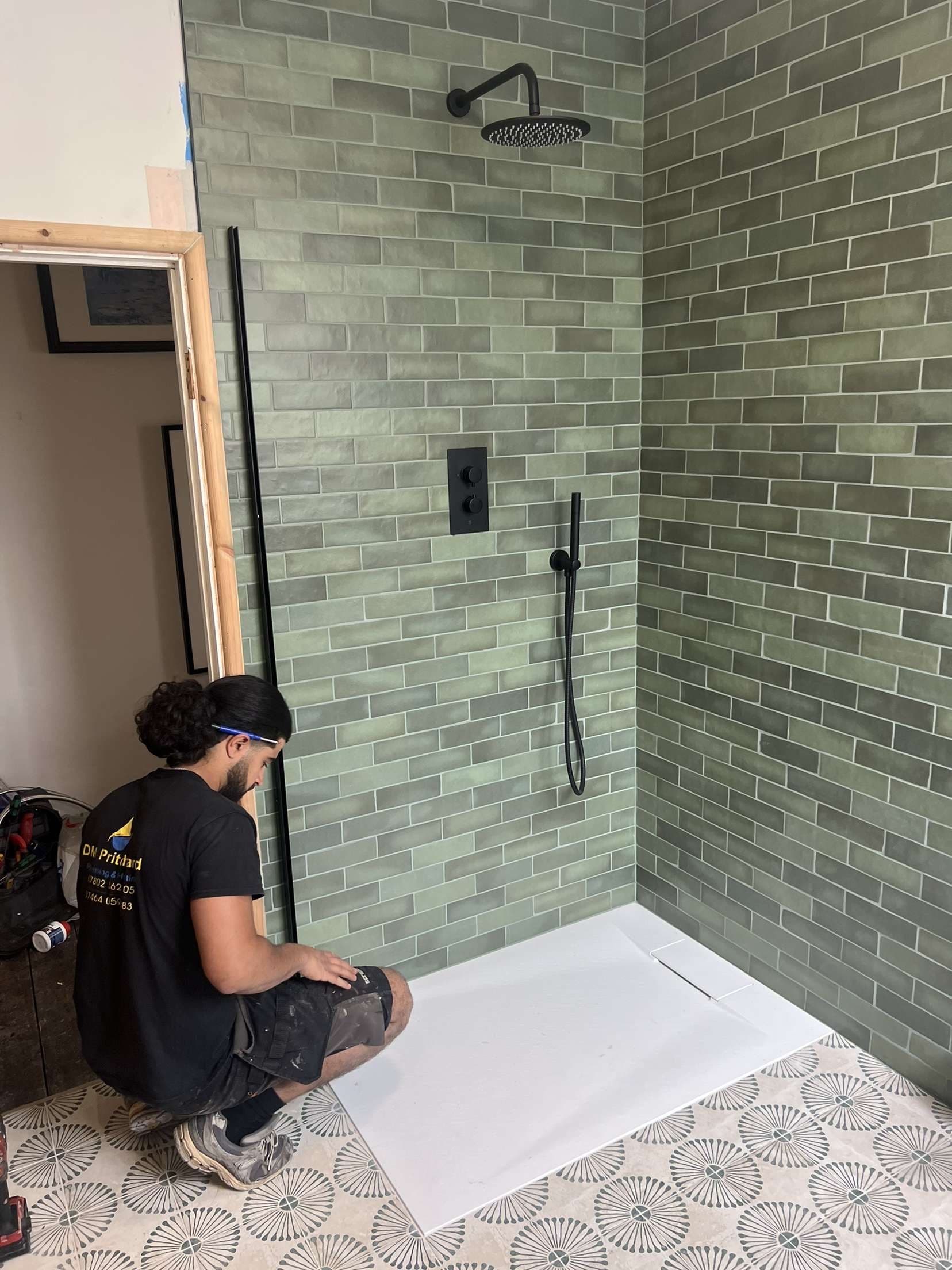 A DM Pritchard engineer fitting a new bathroom